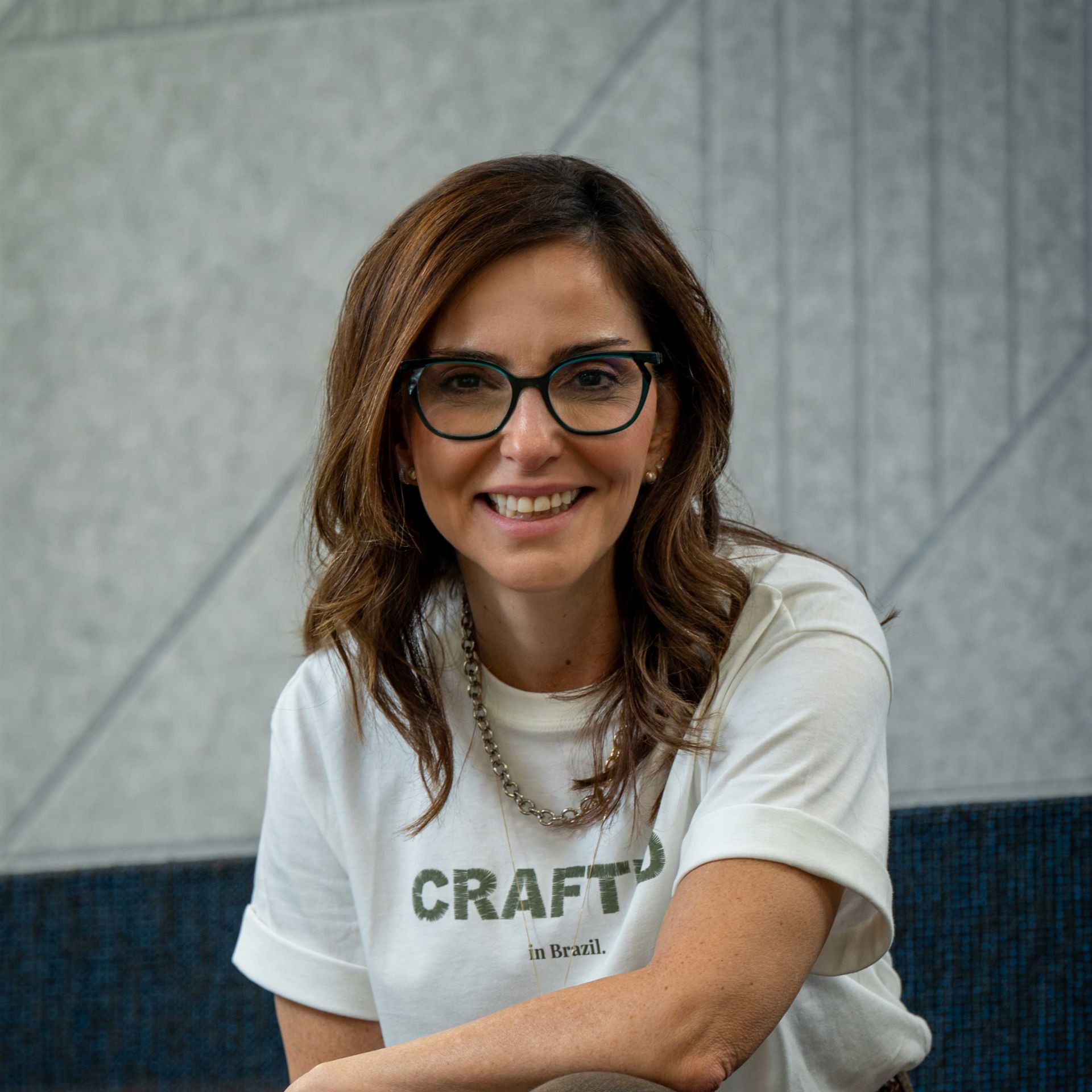 Patricia Acioli smiling at the camera. 